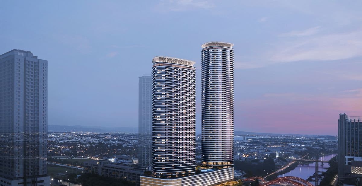 Artist’s perspective of Haraya Residences’ twin condominium towers rising above Bridgetowne Estates and surrounding waterways at dusk