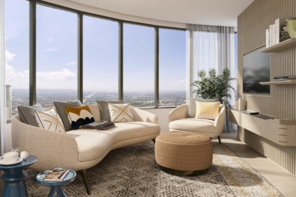 Bright condominium living room with floor-to-ceiling windows and city views