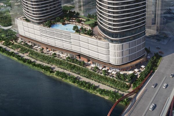 watermark Aerial view of Haraya Residences with nearby roads, landscaped areas, and connected city surroundings
