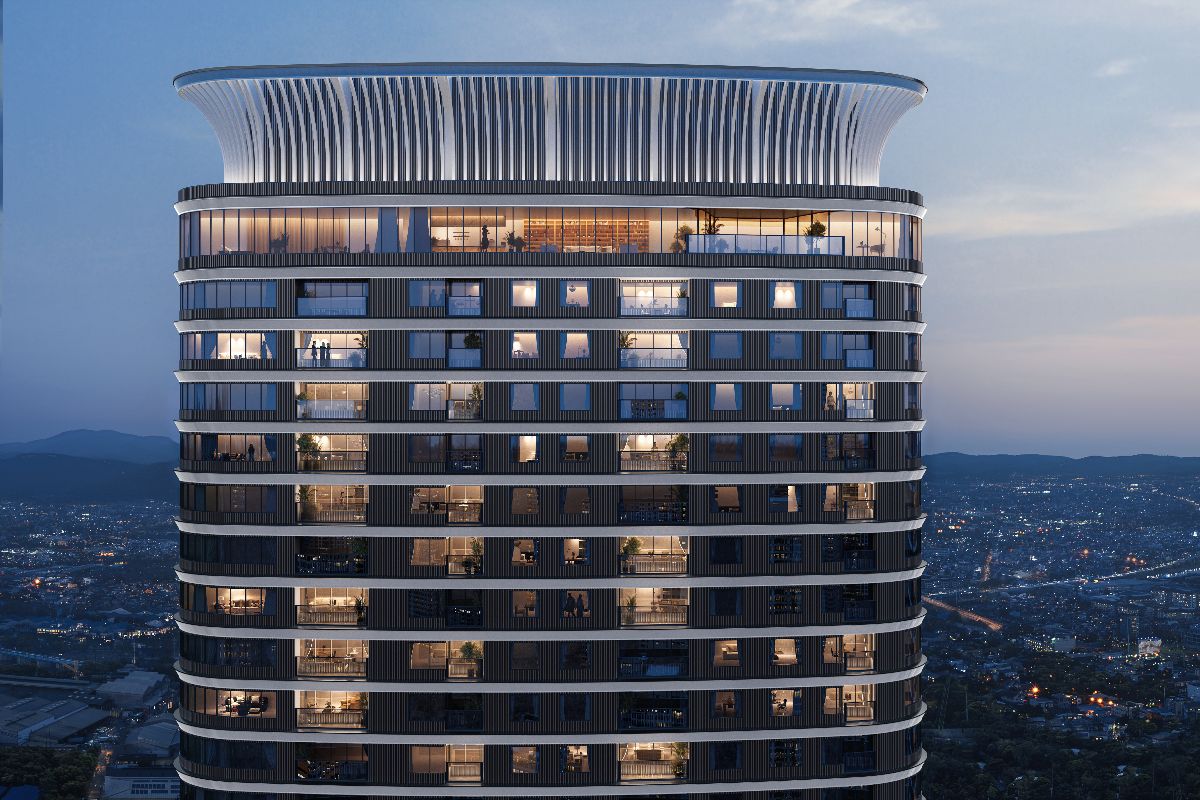 Exterior view of Haraya Residences at dusk, showing high-rise living within the Bridgetowne skyline