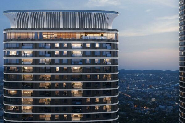 Haraya Residences tower overlooking the city skyline, highlighting elevated condominium living along the C5 Corridor