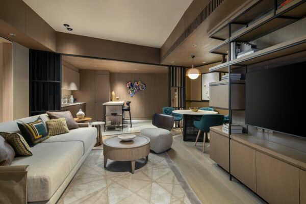 Modern Haraya Residences living and dining area with an open layout, built-in shelving, and contemporary furnishings