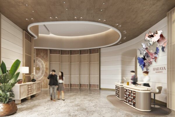 Haraya Residences reception lobby with concierge desk, curved ceiling design, indoor plants, and residents in the common area